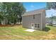 House's rear view, showcasing backyard and patio at 4039 Northerly Island Ct, Gastonia, NC 28056