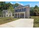 Two-story house with gray siding, a driveway, and landscaping at 4039 Northerly Island Ct, Gastonia, NC 28056