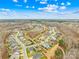 Aerial view of a neighborhood with houses, trees, and a walking path at 423 Granite Lake Ct, Denver, NC 28037