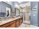 Elegant bathroom with dual vanities and walk-in shower at 423 Granite Lake Ct, Denver, NC 28037