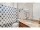 Clean bathroom with granite countertop and patterned shower curtain at 423 Granite Lake Ct, Denver, NC 28037