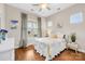 Cozy bedroom with hardwood floors and a ceiling fan at 423 Granite Lake Ct, Denver, NC 28037