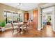 Bright dining area with a round table and chairs, built-in cabinetry, and hardwood floors at 423 Granite Lake Ct, Denver, NC 28037