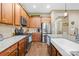 Modern kitchen featuring granite countertops and stainless steel appliances at 423 Granite Lake Ct, Denver, NC 28037