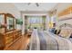 Main bedroom with large windows and hardwood floors at 423 Granite Lake Ct, Denver, NC 28037