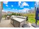 Outdoor kitchen with grill and bar seating at 423 Granite Lake Ct, Denver, NC 28037