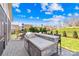 This backyard patio features a stone outdoor kitchen with seating and grill, perfect for entertaining on sunny day at 423 Granite Lake Ct, Denver, NC 28037