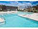 Expansive outdoor pool area with multiple pools and fire pit at 423 Granite Lake Ct, Denver, NC 28037