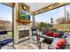 Screened porch with fireplace and comfortable seating at 423 Granite Lake Ct, Denver, NC 28037