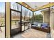 Screened porch with outdoor kitchen and seating area at 423 Granite Lake Ct, Denver, NC 28037