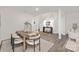 Modern dining area features a wooden table with seating for six, with contemporary decor and an open layout at 444 Berryman Rd, Rock Hill, SC 29732