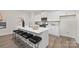 Spacious kitchen featuring an island with barstool seating, quartz countertops, and stainless steel appliances at 444 Berryman Rd, Rock Hill, SC 29732