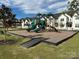 Inviting community playground with multiple slides and other play equipment near new construction homes at 444 Berryman Rd, Rock Hill, SC 29732