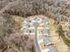 Aerial view of a cul-de-sac with a lot outlined in yellow, surrounded by trees and single Gathering homes at 4551 Selhurst Dr, Indian Land, SC 29707