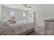 Bright and airy bedroom featuring natural light, neutral color scheme, and carpet flooring at 4551 Selhurst Dr, Indian Land, SC 29707