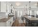 Modern kitchen with granite countertops and white cabinets at 4551 Selhurst Dr, Indian Land, SC 29707