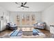 Bright living room featuring a modern fireplace, recessed lighting and french doors to a view at 4551 Selhurst Dr, Indian Land, SC 29707