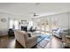 Inviting living room with fireplace, hardwood floors, and abundant natural light at 4551 Selhurst Dr, Indian Land, SC 29707