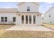 Patio view with sliding glass doors leading into the home with minimal landscaping at 4551 Selhurst Dr, Indian Land, SC 29707