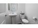 Clean powder room with pedestal sink and white toilet at 4551 Selhurst Dr, Indian Land, SC 29707