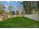 Fenced backyard providing a private green space at 520 Stegall St, Charlotte, NC 28217