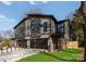 Modern three-unit building with gray siding and stone accents at 520 Stegall St, Charlotte, NC 28217