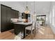 Modern kitchen with dark cabinetry, large island, and pendant lighting at 520 Stegall St, Charlotte, NC 28217