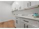 Clean laundry room with white cabinets and ample counter space at 520 Stegall St, Charlotte, NC 28217