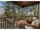 Relaxing screened porch with wooden furniture and backyard view at 520 Stegall St, Charlotte, NC 28217