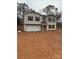 Two-story house with a two-car garage and burgundy shutters at 919 W Sumter St, Shelby, NC 28150