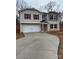 Two-story house with a two-car garage and burgundy shutters at 919 W Sumter St, Shelby, NC 28150