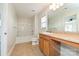 Bathroom with tub, toilet and wood vanity at 1021 Kings Mountain Ln, Gastonia, NC 28054