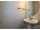 Clean bathroom with pedestal sink and oval mirror at 1021 Kings Mountain Ln, Gastonia, NC 28054