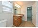 Bathroom with vanity, sink, toilet and walk-in closet at 1021 Kings Mountain Ln, Gastonia, NC 28054