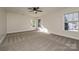 Bright bedroom with carpet, ceiling fan and multiple windows at 1021 Kings Mountain Ln, Gastonia, NC 28054