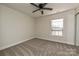 Bright bedroom with ceiling fan and window blinds at 1021 Kings Mountain Ln, Gastonia, NC 28054