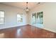 Bright dining room with hardwood floors and sliding glass door to patio at 1021 Kings Mountain Ln, Gastonia, NC 28054