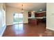 Kitchen and dining area with hardwood floors and access to backyard at 1021 Kings Mountain Ln, Gastonia, NC 28054