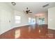 Hardwood floor living room with access to kitchen and stairs at 1021 Kings Mountain Ln, Gastonia, NC 28054