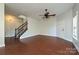 Spacious living room with hardwood floors and a ceiling fan at 1021 Kings Mountain Ln, Gastonia, NC 28054