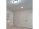 Bedroom with double doors and access to hallway at 15334 S Birkdale Commons Pkwy, Huntersville, NC 28078