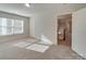 Bright bedroom with window, neutral walls, and carpet at 15334 S Birkdale Commons Pkwy, Huntersville, NC 28078