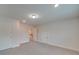 Bright bedroom featuring carpet, multiple doors, and neutral walls at 15334 S Birkdale Commons Pkwy, Huntersville, NC 28078