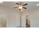 Bright bedroom with ceiling fan and access to bathroom at 15334 S Birkdale Commons Pkwy, Huntersville, NC 28078