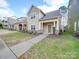 Row of houses with similar design, showcasing a cohesive community aesthetic at 15334 S Birkdale Commons Pkwy, Huntersville, NC 28078