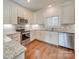 Modern kitchen with stainless steel appliances and granite countertops at 15334 S Birkdale Commons Pkwy, Huntersville, NC 28078