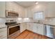 Modern kitchen with stainless steel appliances and granite countertops at 15334 S Birkdale Commons Pkwy, Huntersville, NC 28078