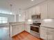 Modern kitchen with stainless steel appliances and granite countertops at 15334 S Birkdale Commons Pkwy, Huntersville, NC 28078