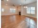 Bright and airy living room with hardwood floors, fireplace and large windows at 15334 S Birkdale Commons Pkwy, Huntersville, NC 28078