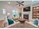 Living room with fireplace, hardwood floors, and comfortable seating area at 15334 S Birkdale Commons Pkwy, Huntersville, NC 28078